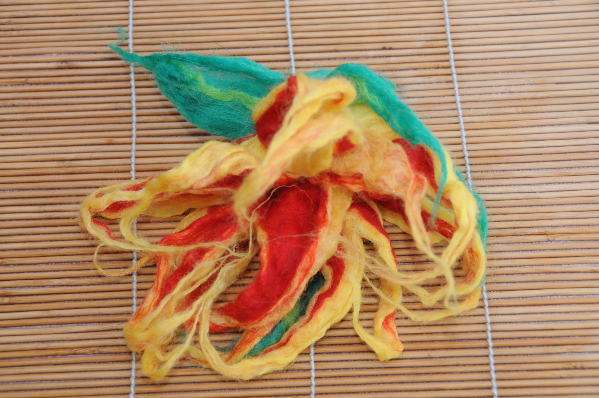 The flower after it was put in hot and cold water to help with the felting process.
