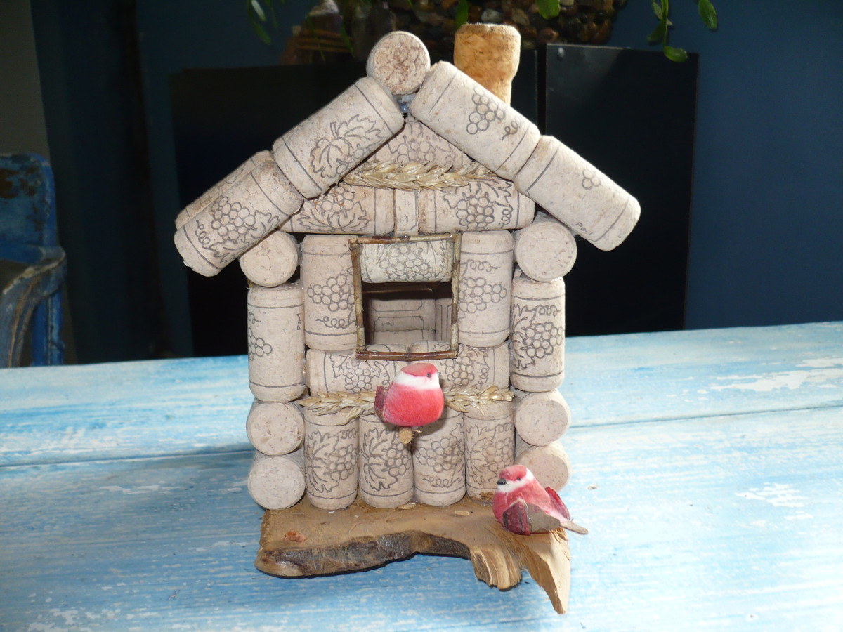 See how to cut the triangle cork to fit the top hole of the front of the bird house.