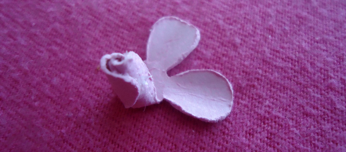Then bend up another petal and glue it.  Keep doing this until all petals are folded up and adhered. 