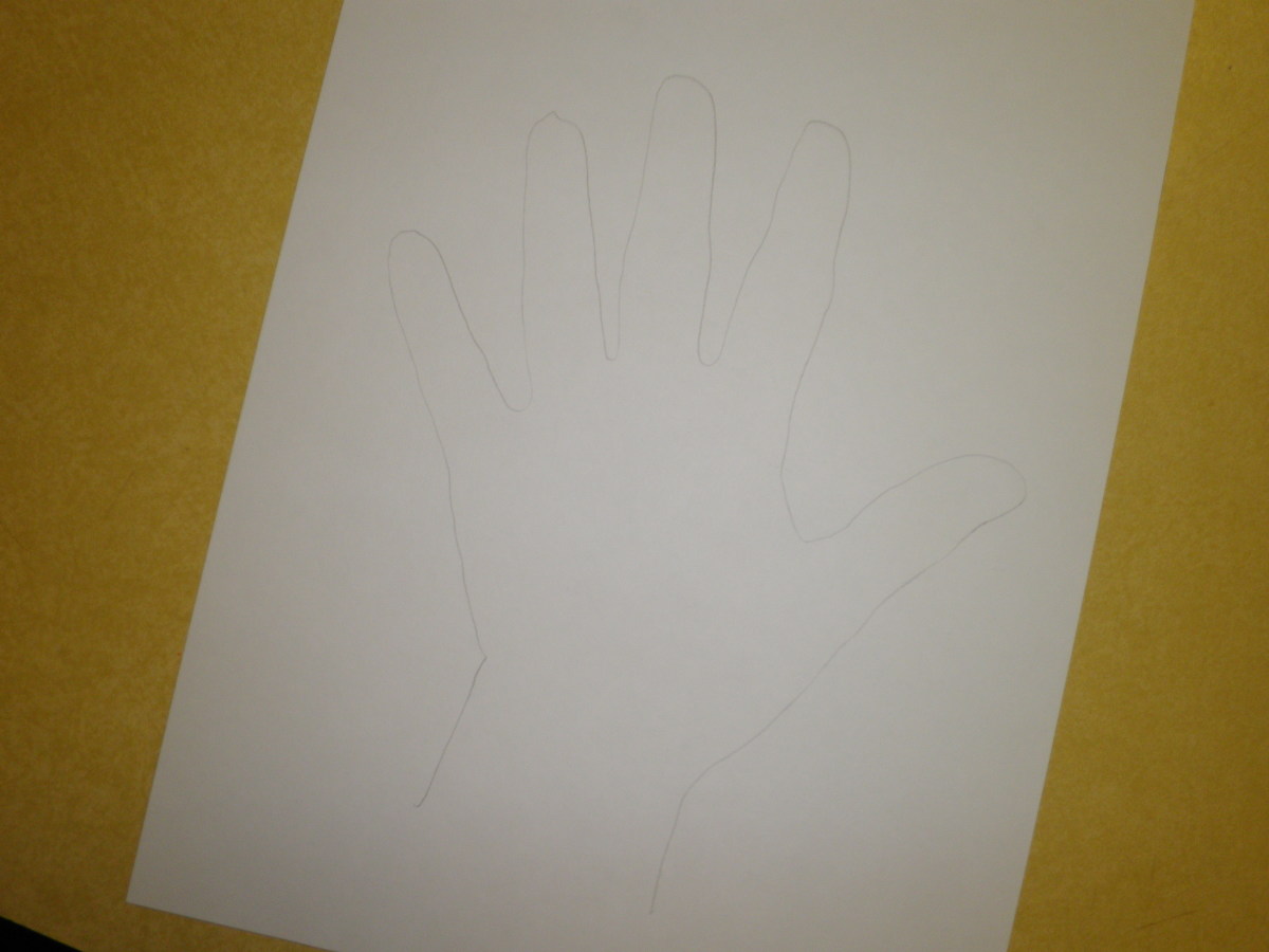Start by tracing your hand in pencil. 