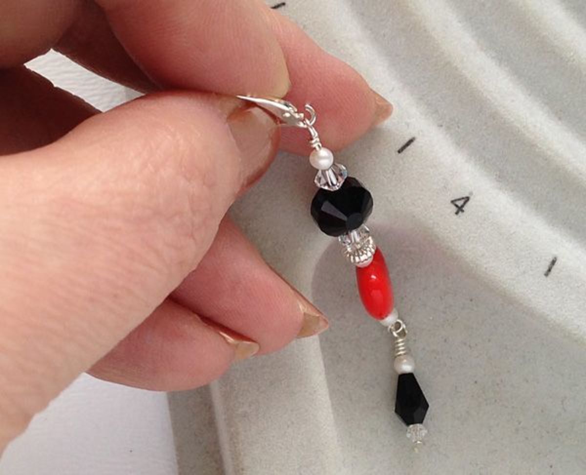 Open the loop on the ear wire to attach the beaded dangle