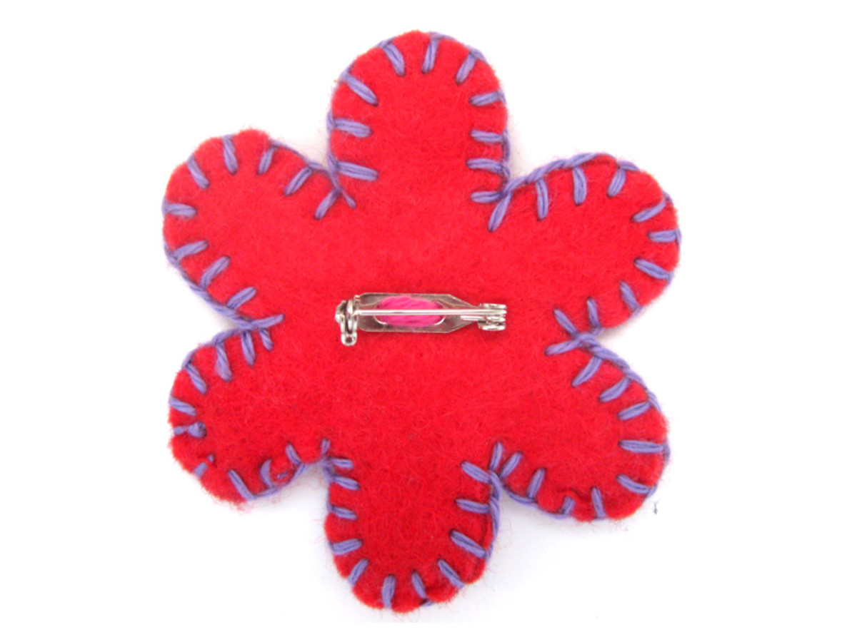 Demonstrates the brooch sewed on the back of the felt flower. Click on the image to enlarge.