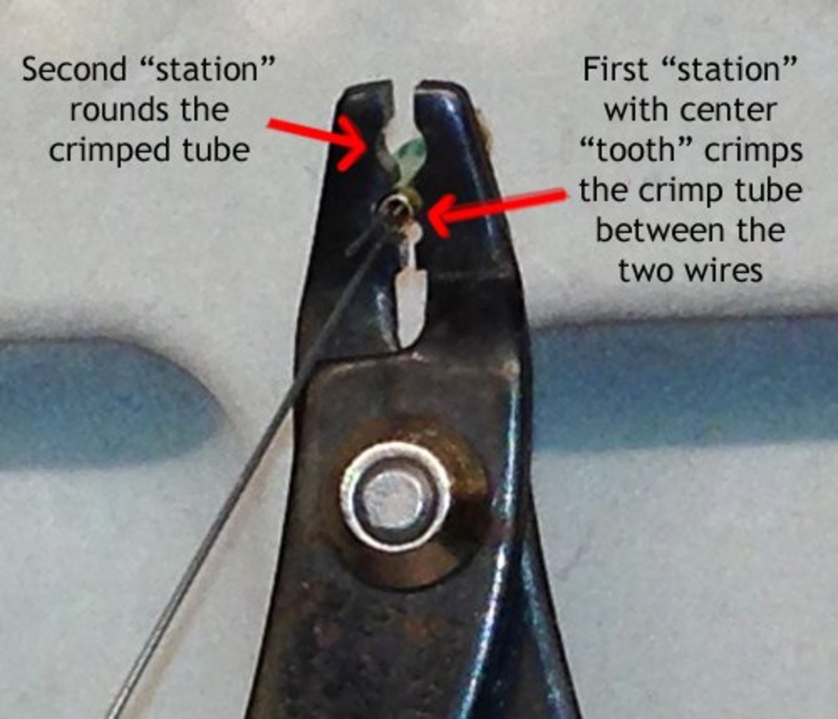 How crimping pliers work - the notch with the "tooth" separates the two strands of beading wire; the other notch folds over and rounds the bead crimp.