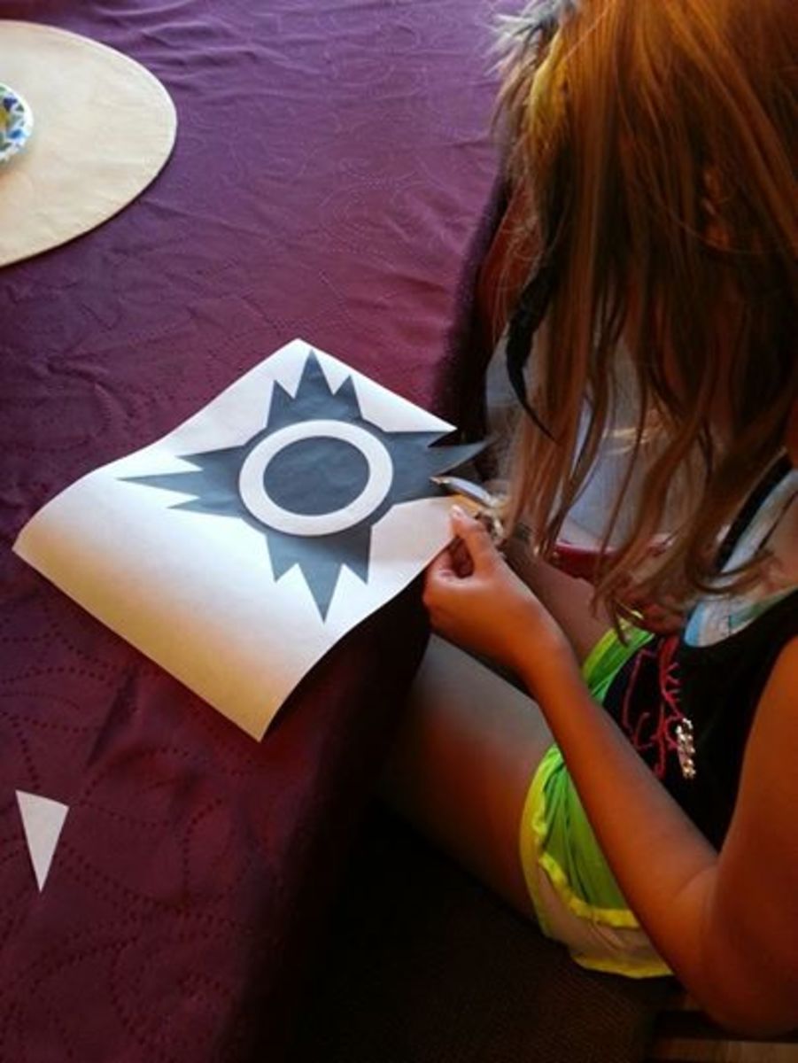 Cut the symbol out of the freezer paper to make the perfect template for your shirt. 