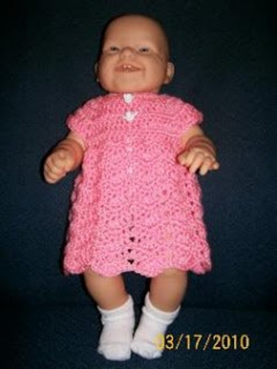 Baby ripple baby dress on a doll