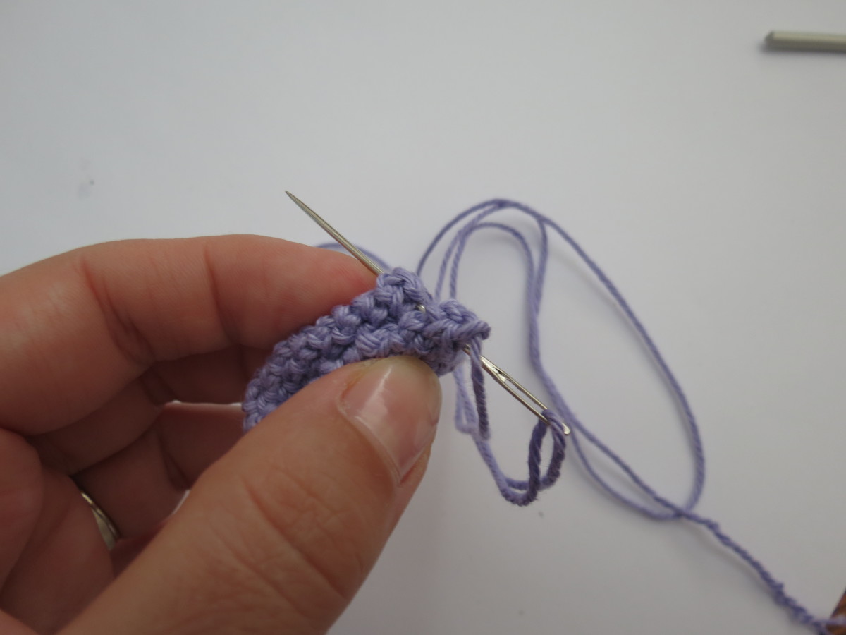 Sew the two edges of the ear together with a yarn needle.