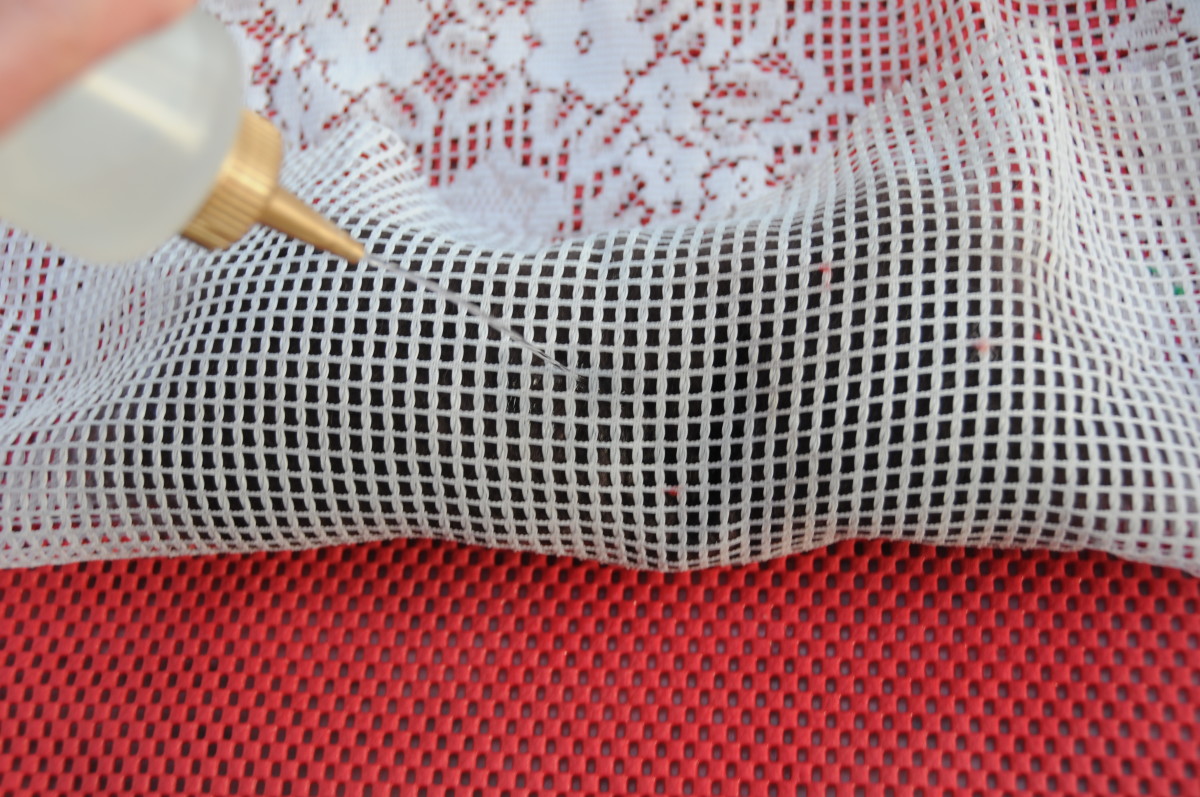 5. Pull the netting up and around the wool, wet and smooth the fibers down until the shoe last is evenly covered.