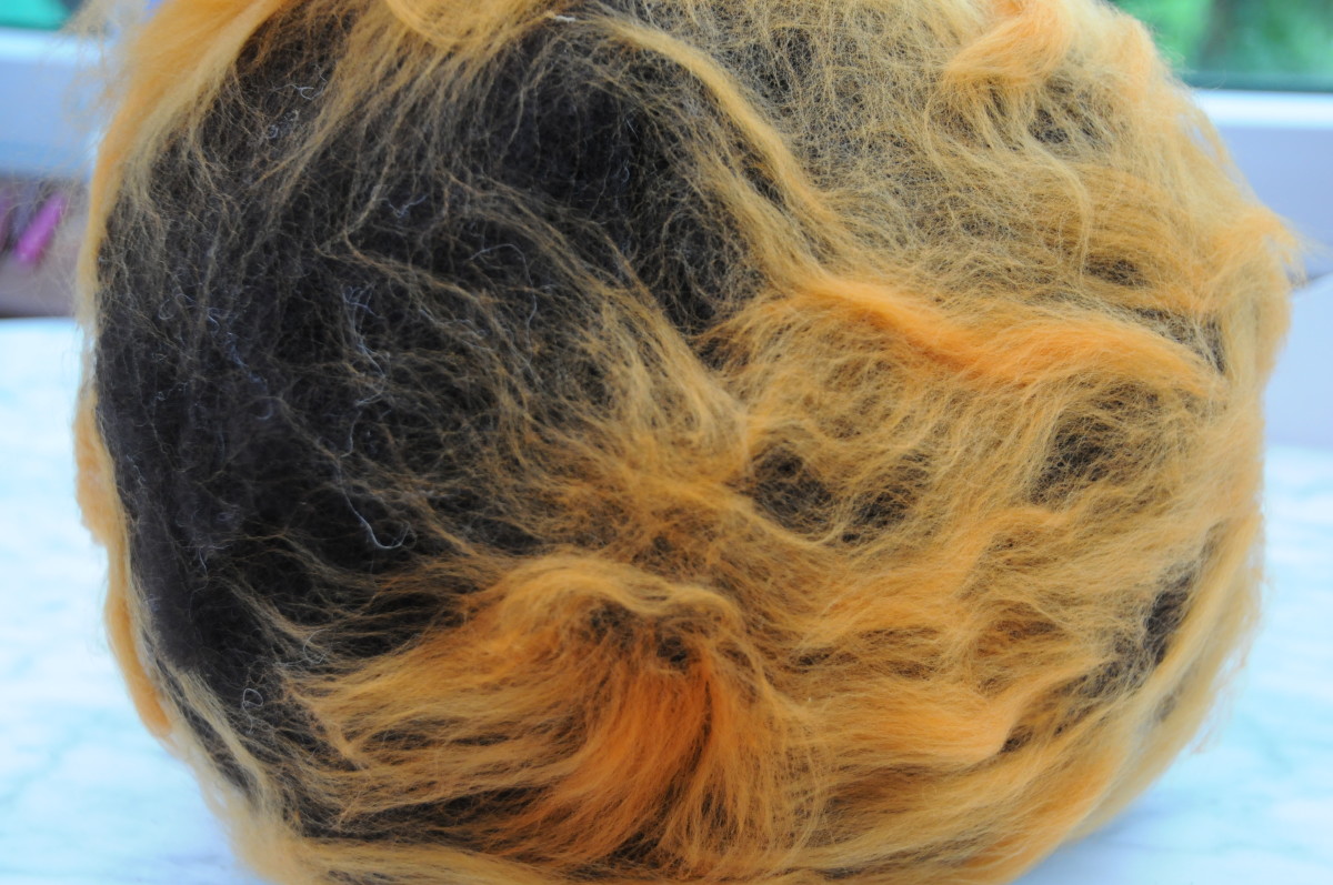 Add some colored Merino Wool fibers as shown.