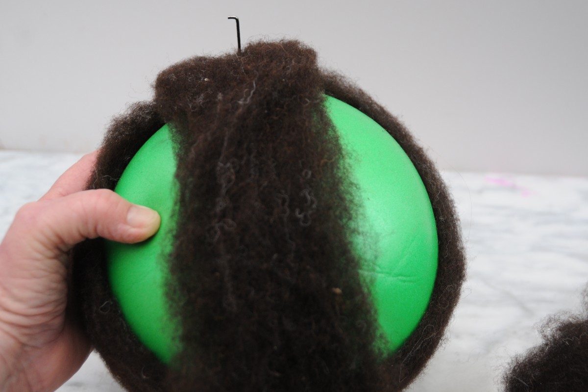 Needle felt the wool together, without touching the surface of the ball