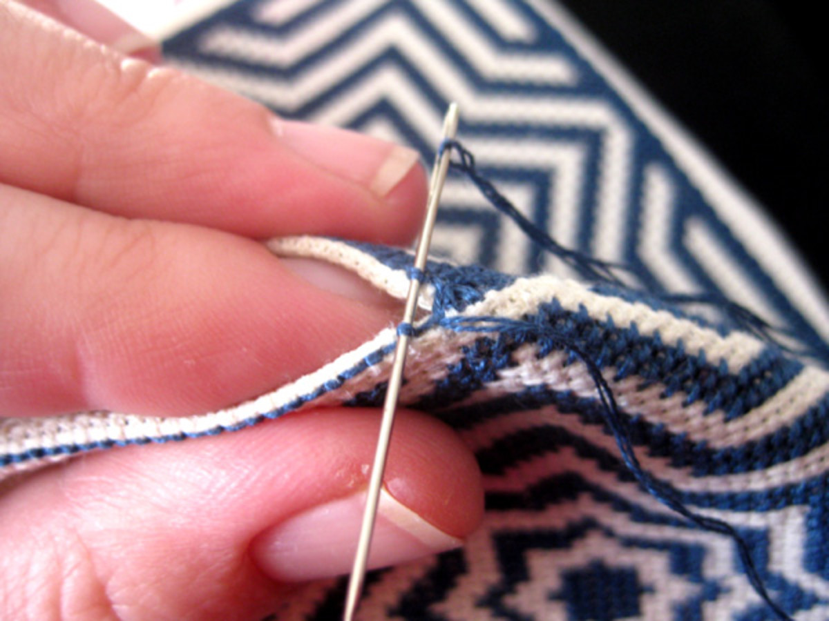 Holding the fabric together to stitch easily around a corner.