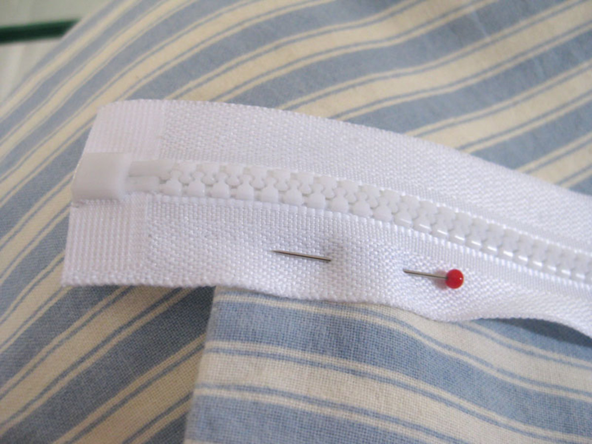The end of the zipper may hang off the end of the pillowcase, but this is fine, just pin it into place for a guide.
