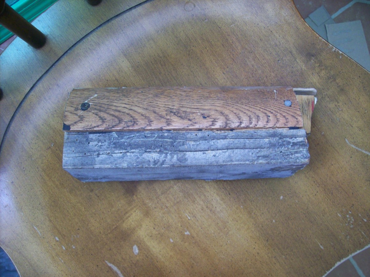 Side view of hull mold. Made from threshold material I used on a laminate floor. Scraps are inexpensive at Home Depot. The pieces were tied to a piece of 2"X 4" no more than 9" long.