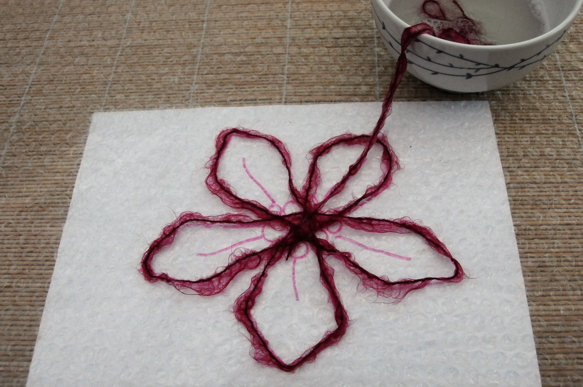 Cover the outline of the flower with the mohair yarn.