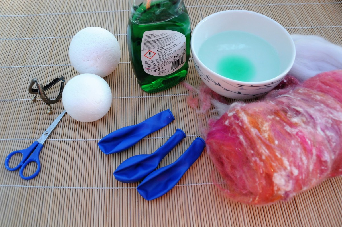 2 Polystyrene balls, dish washing liquid, white merino wool roving, a wool Batt and 2 or 3 party balloons.