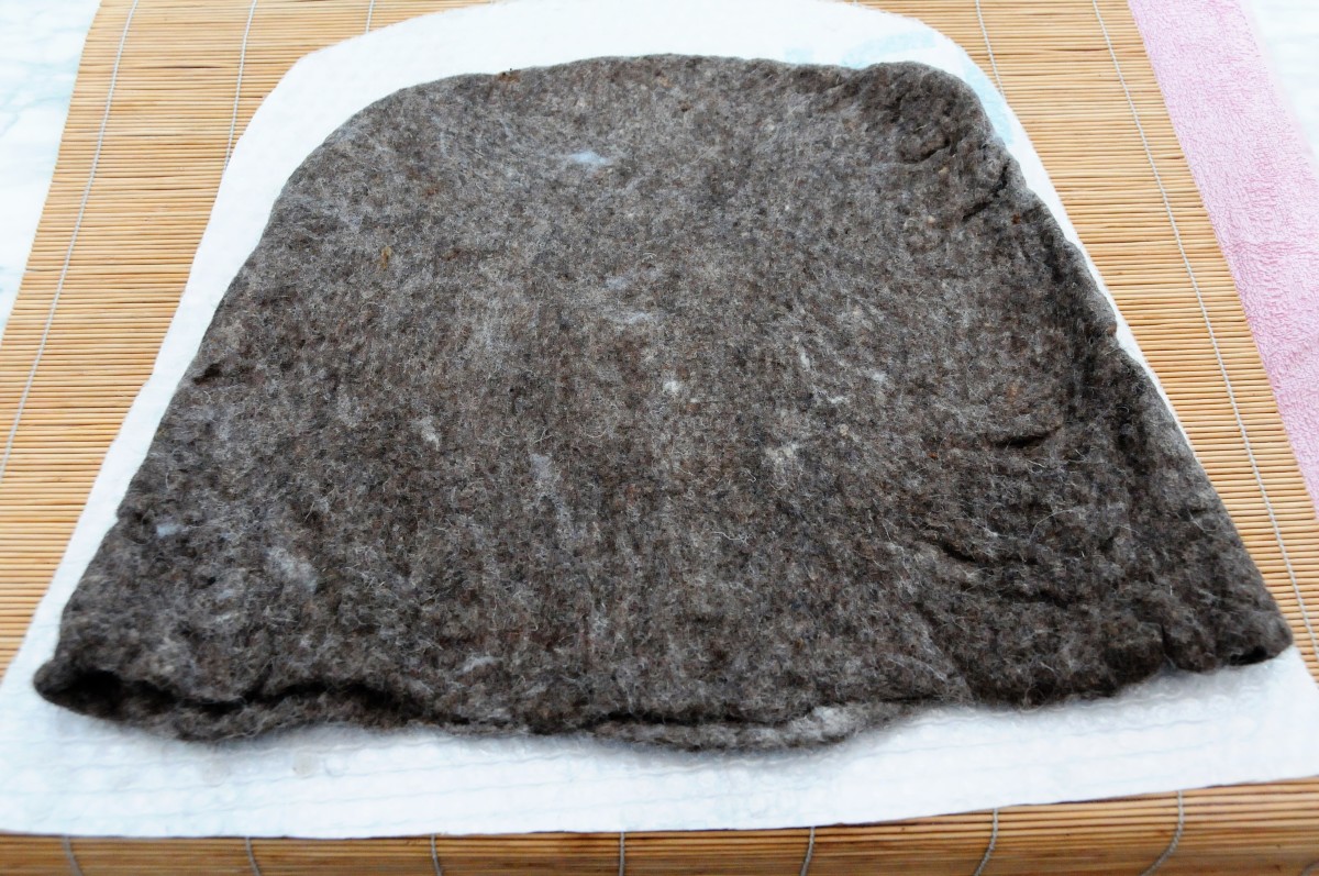 The shrinkage which took place inside the tumble dryer, measured against the plastic template.