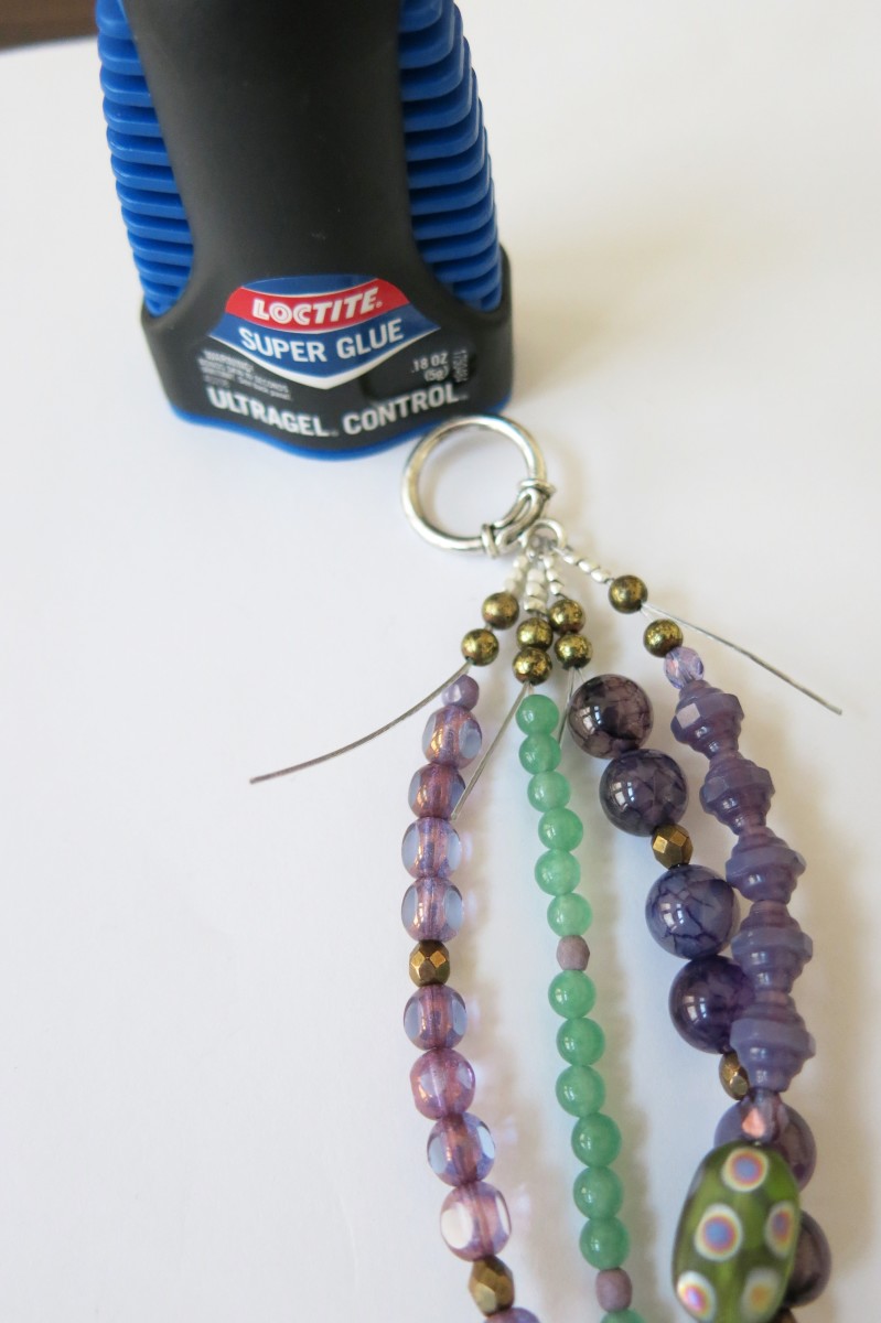 Putting the finishing touches on your multi-strand beaded necklace.
