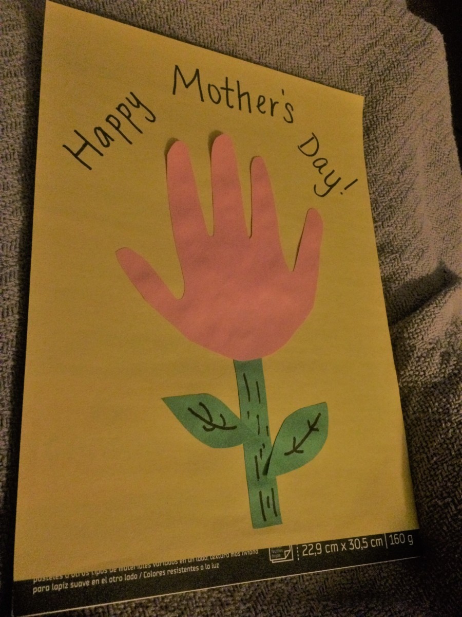 Paste the cutouts on the art page for the Mother's Day craft.