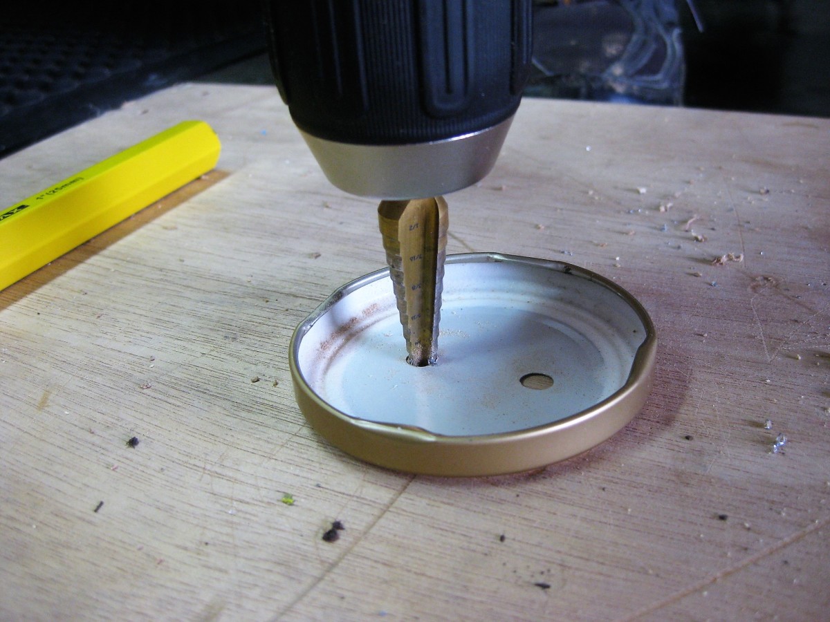 Drill two holes on outer edges of where you want slot to be.  