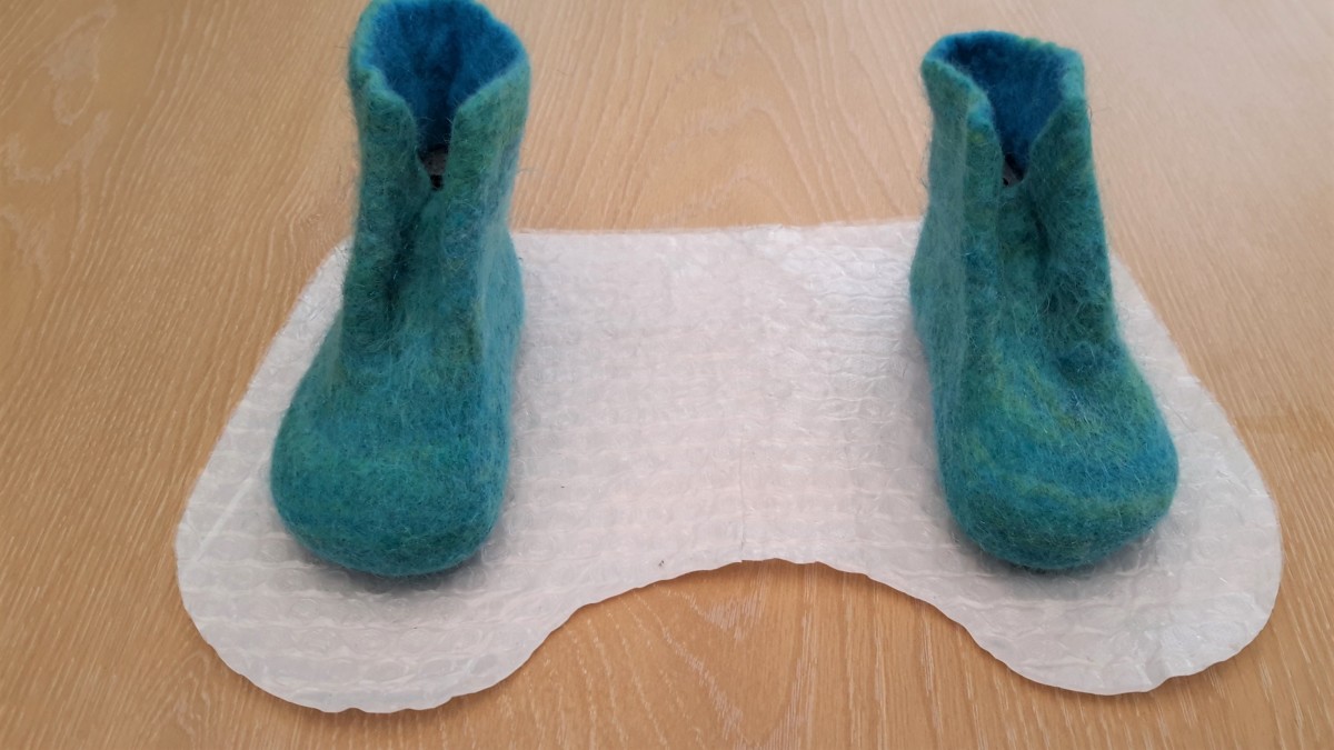 The finished slippers on the Template showing the shrinkage which took place.