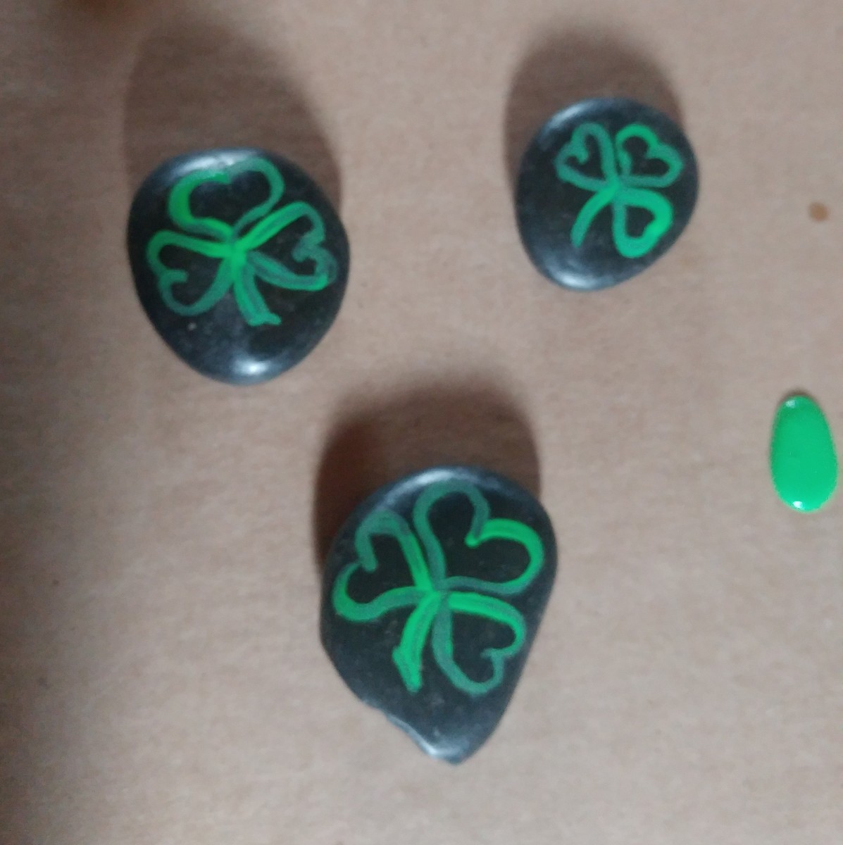 Draw the outline of shamrocks first.
