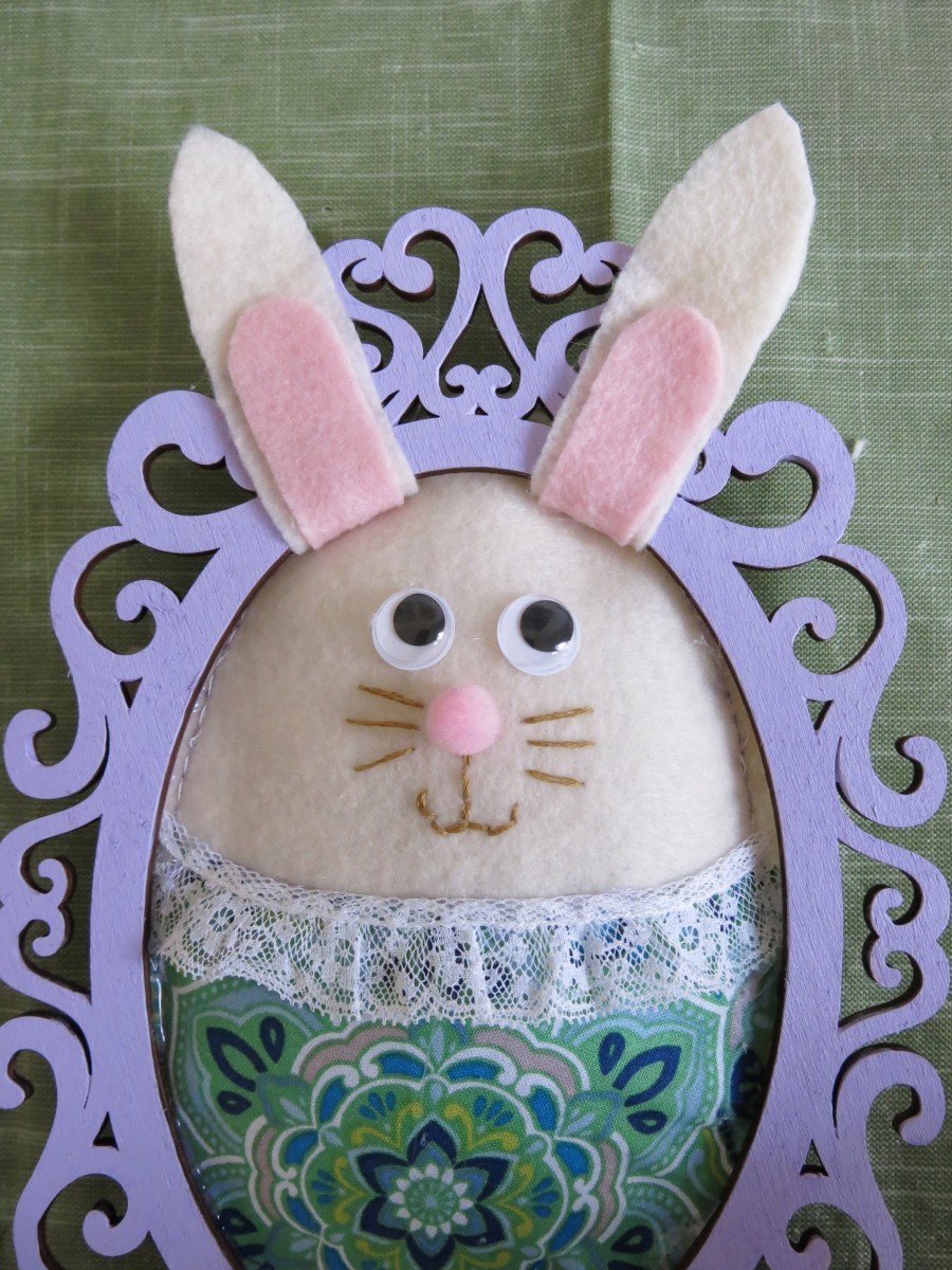 Add a small amount of hot glue to your frame to attach your bunny's ears in the upright position.