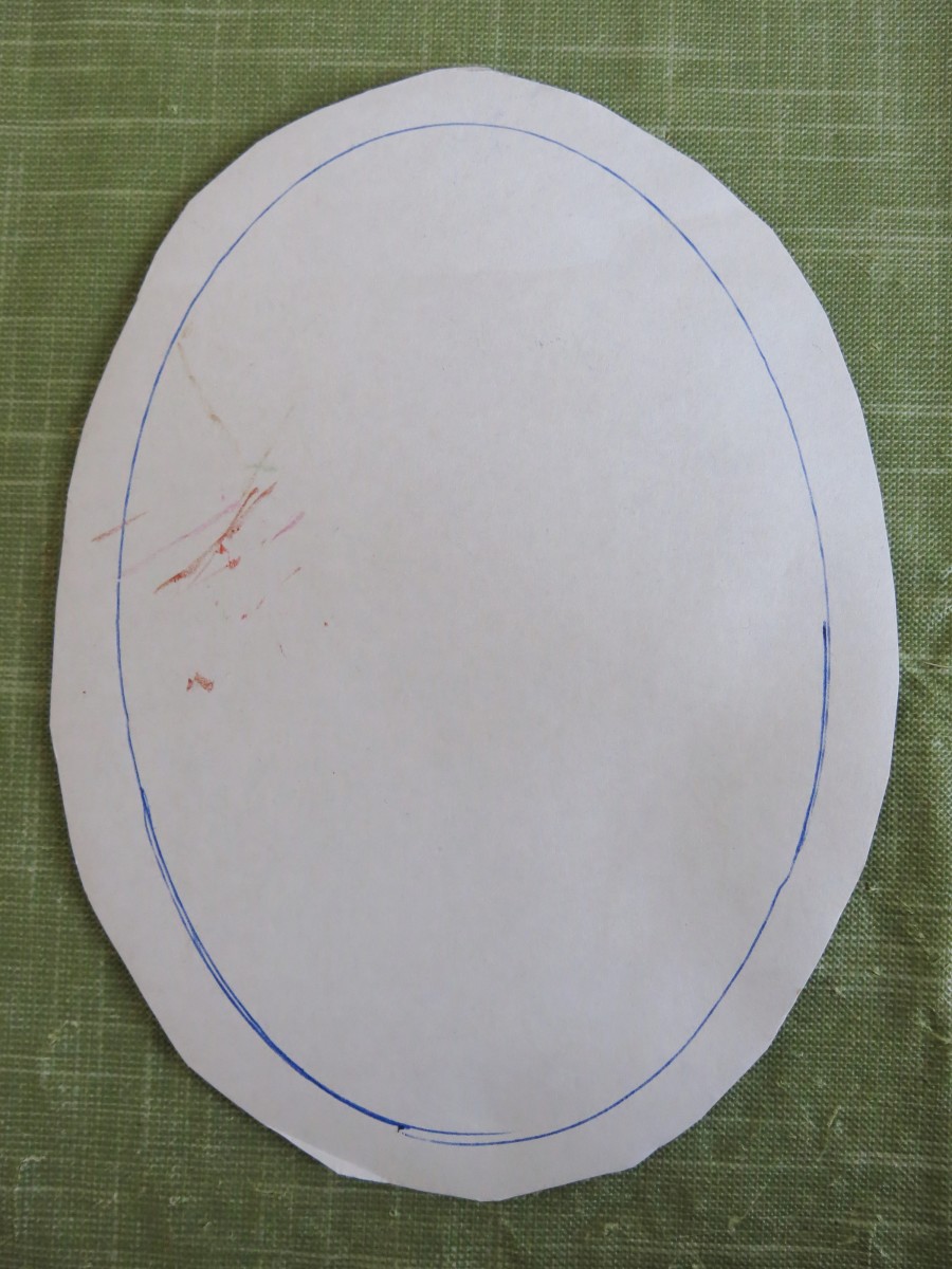 Trace the inside oval of your frame on to a piece of cardboard.