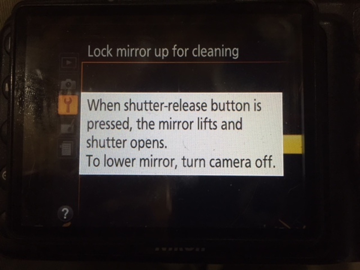 When shutter-release button is pressed, the mirror lifts and shutter opens. To lower mirror, turn camera off.