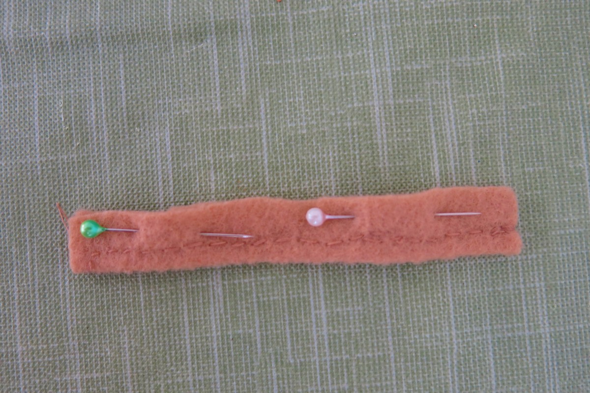Sew a felt tube to cover the wire for the tail.