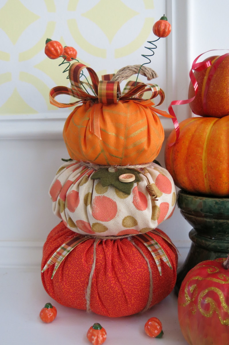 This stacked pumpkin topiary looks lovely alongside other fall decorations.