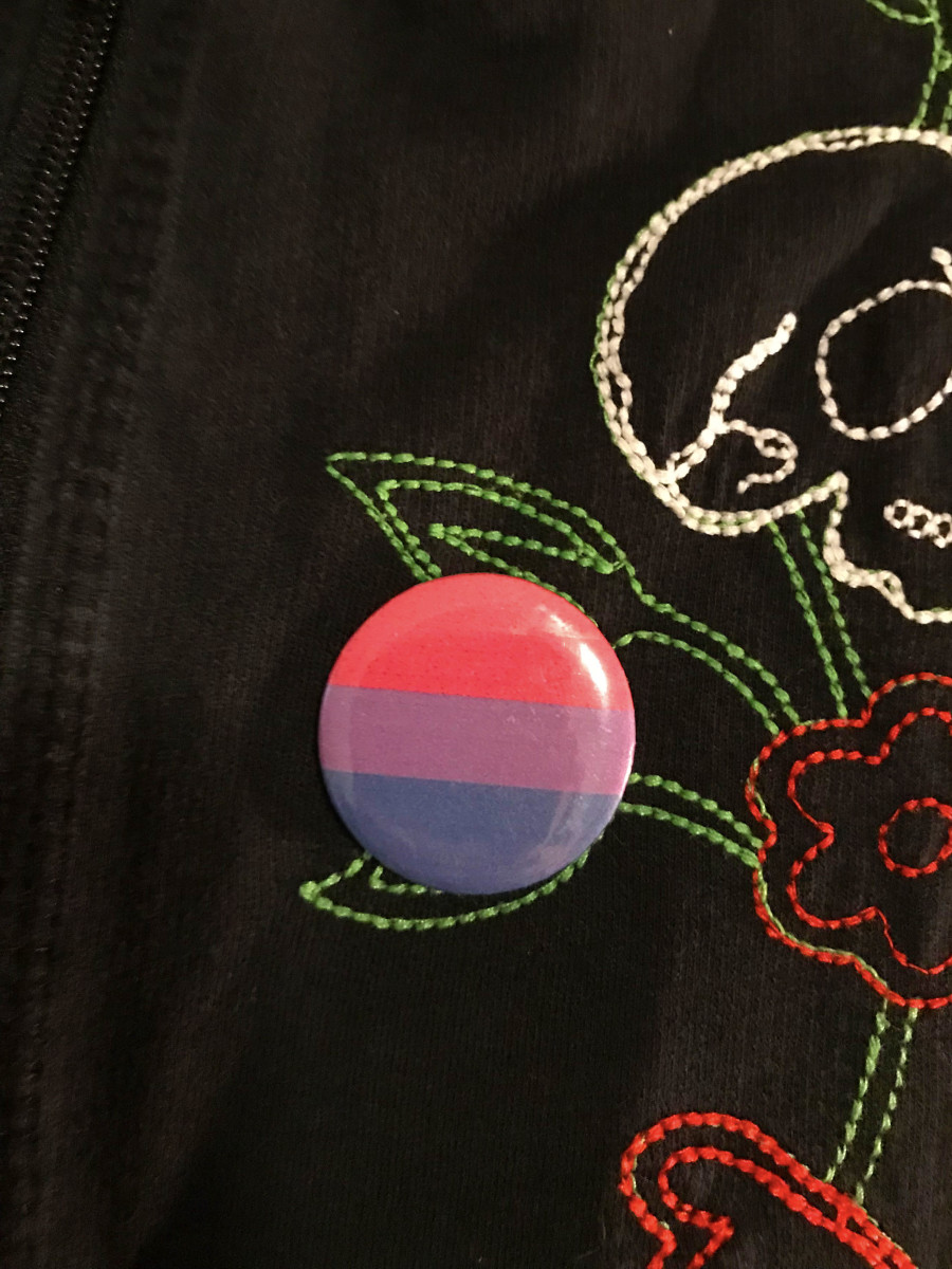 Proudly wear bi pride symbols, such as this button featuring the bi pride flag, on Bi Visibility Day to increase awareness!