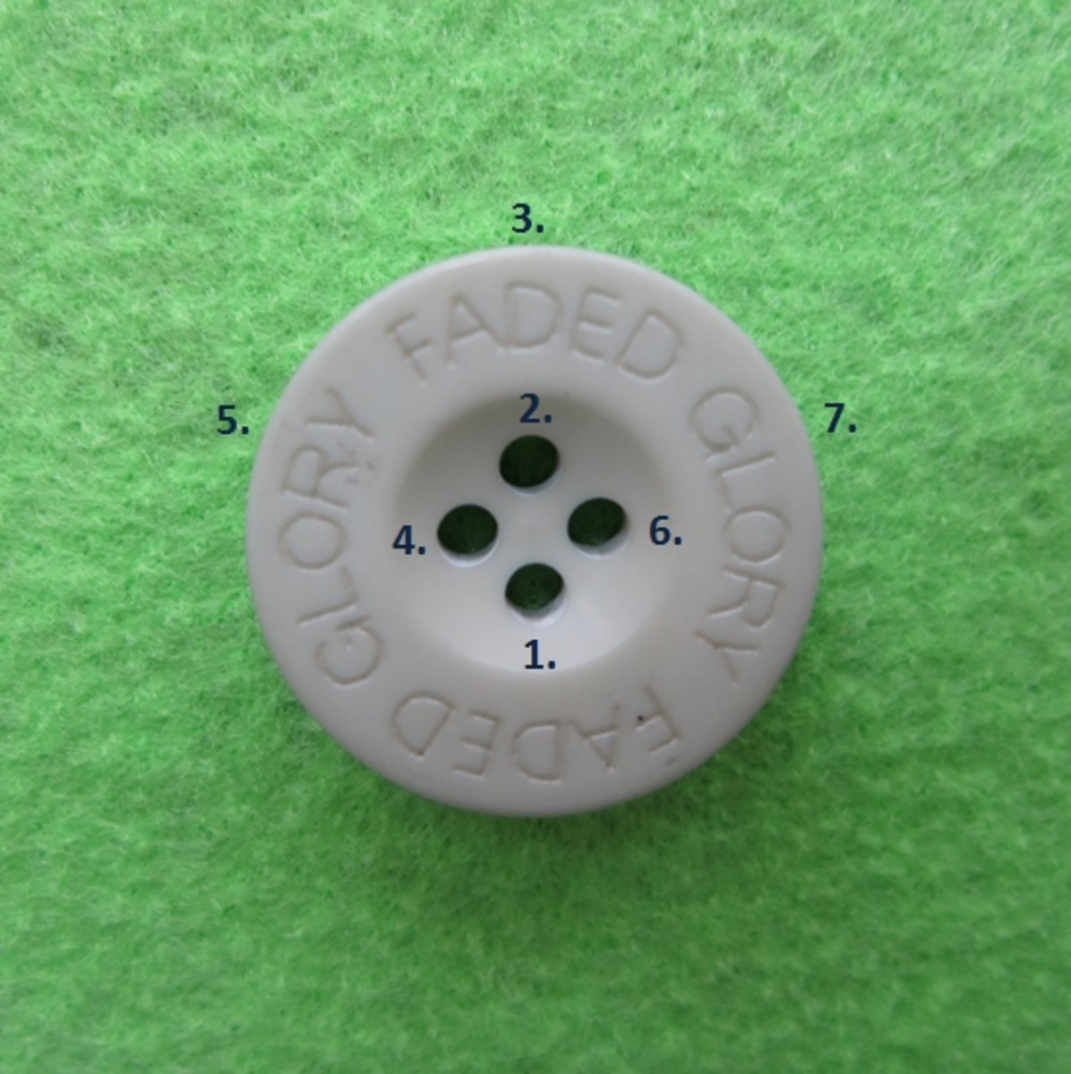 Place your button over its marked spot on your felt with the button holes positioned in a diamond shape.