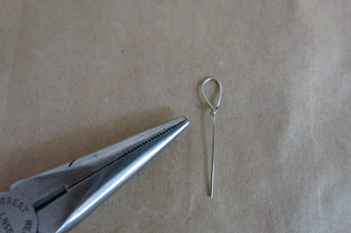 Making a loop in a head pin with needle nose pliers