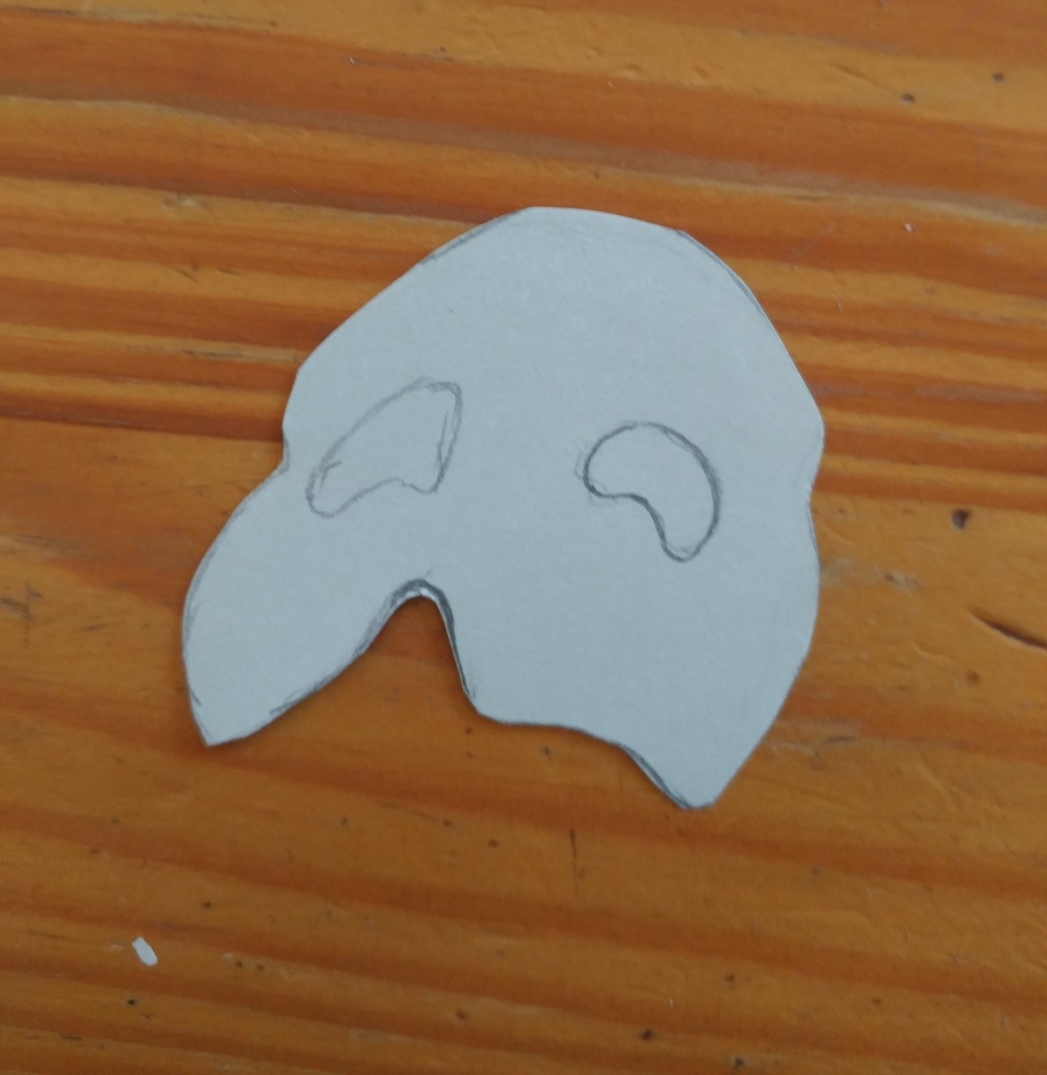 Cut out the shape of the mask out of white cardstock.