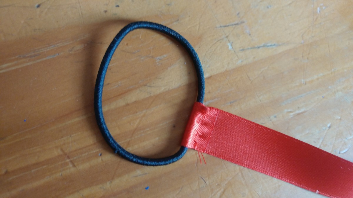 Sew a hair tie on one end of the ribbon.