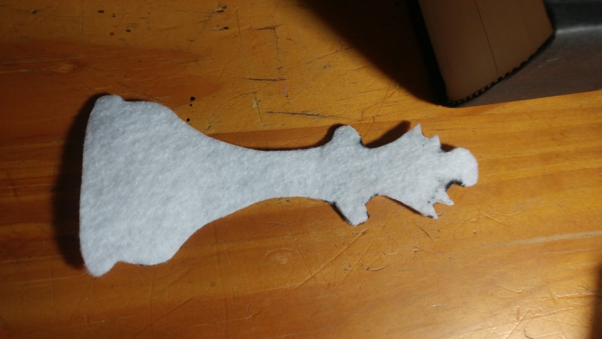 Cut out in white felt, the rook from the Breaking Dawn cover.