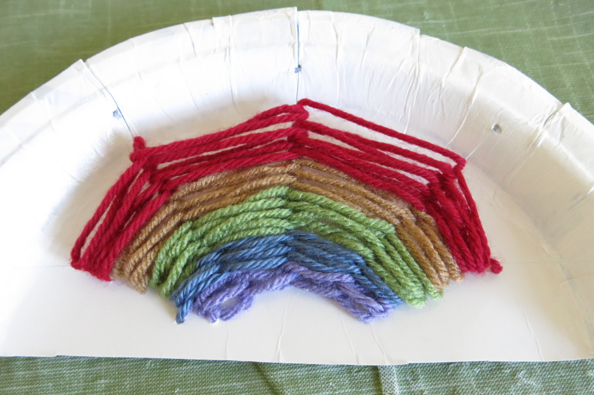 diy-childrens-craft-how-to-make-a-paper-plate-rainbow-with-yarn