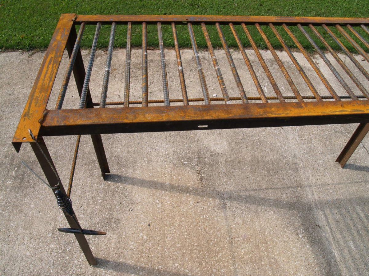 Check out the links below to find instructions on how you can make this welding table in your home shop from rebar and scrap bed frame metal.