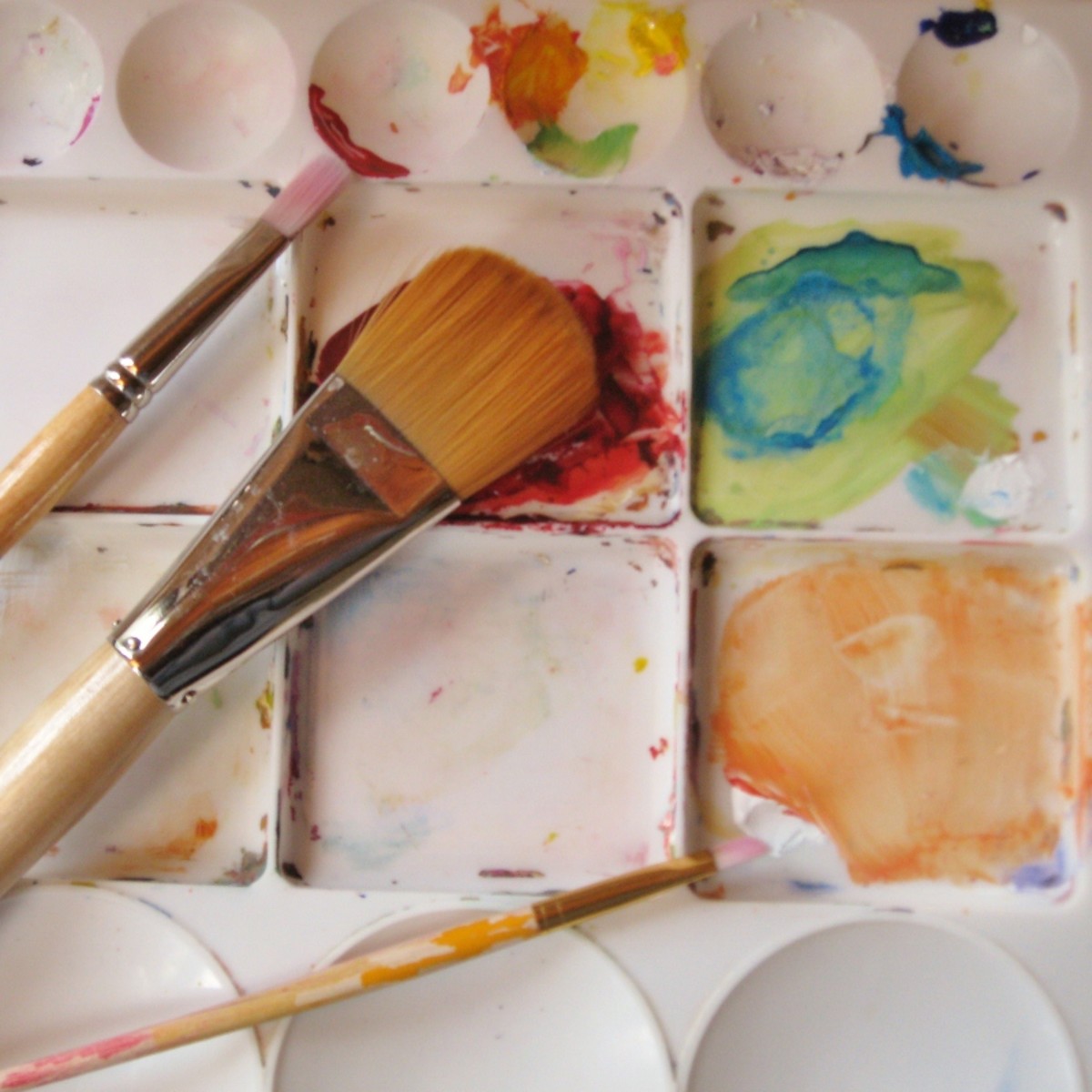 Brushes and a plastic mixing palette.