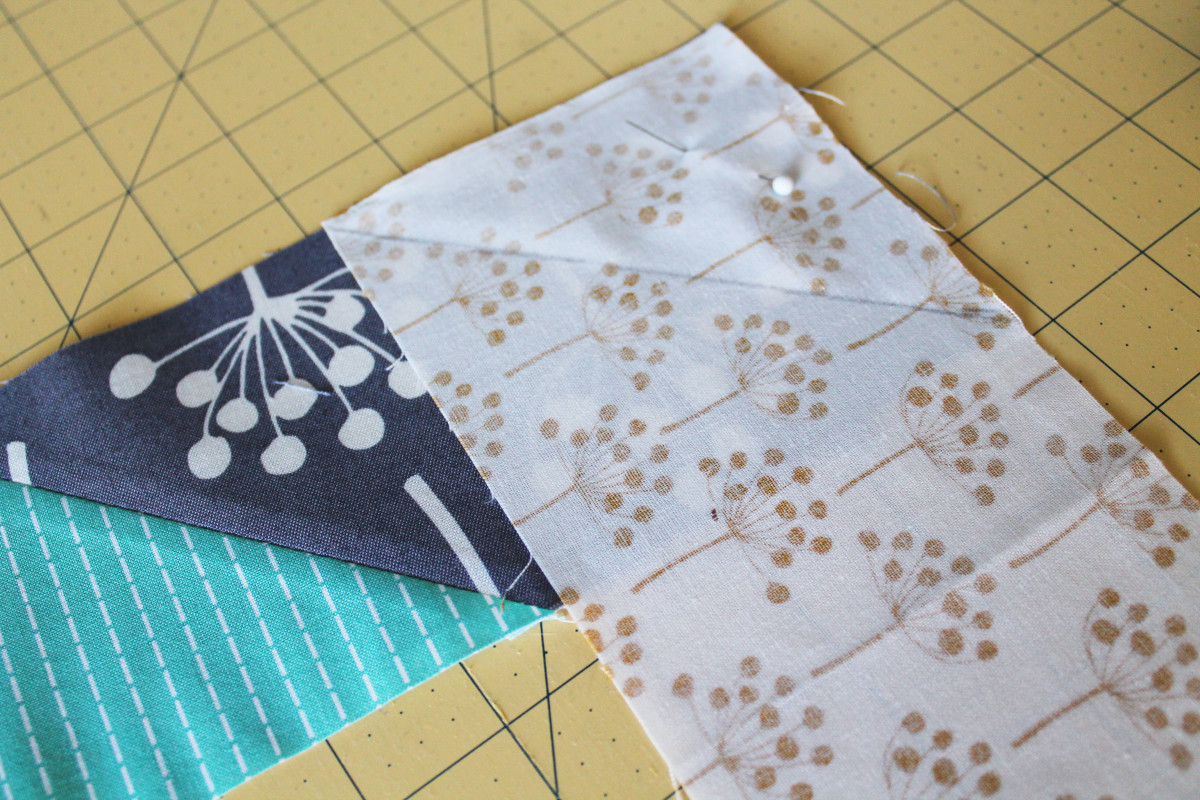 It's fine to use a variety of fabric scraps for this project; you can sew them together into one long strip.