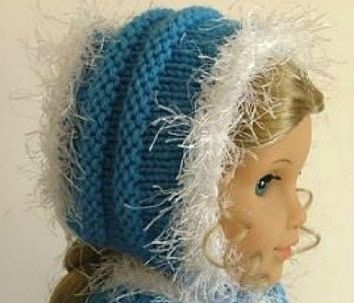 Faux fur-trimmed knitted cap