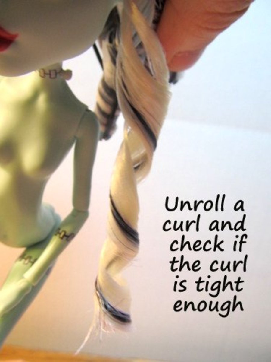 After dunking the doll in cold water, unroll one of the curls to see if it's tight enough.