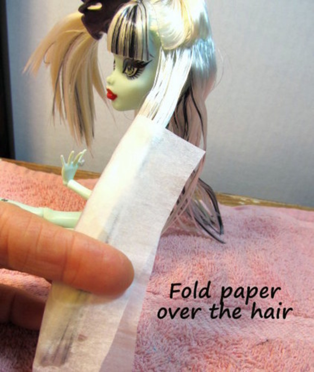Fold the paper over the hair.