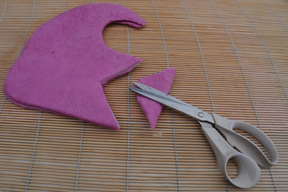 Fold the slipper in half and cut a 'v' as shown.