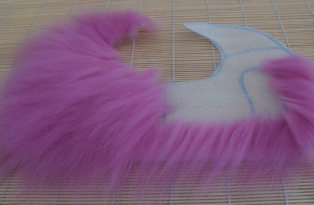 The pixie shoe template half-covered in wool roving