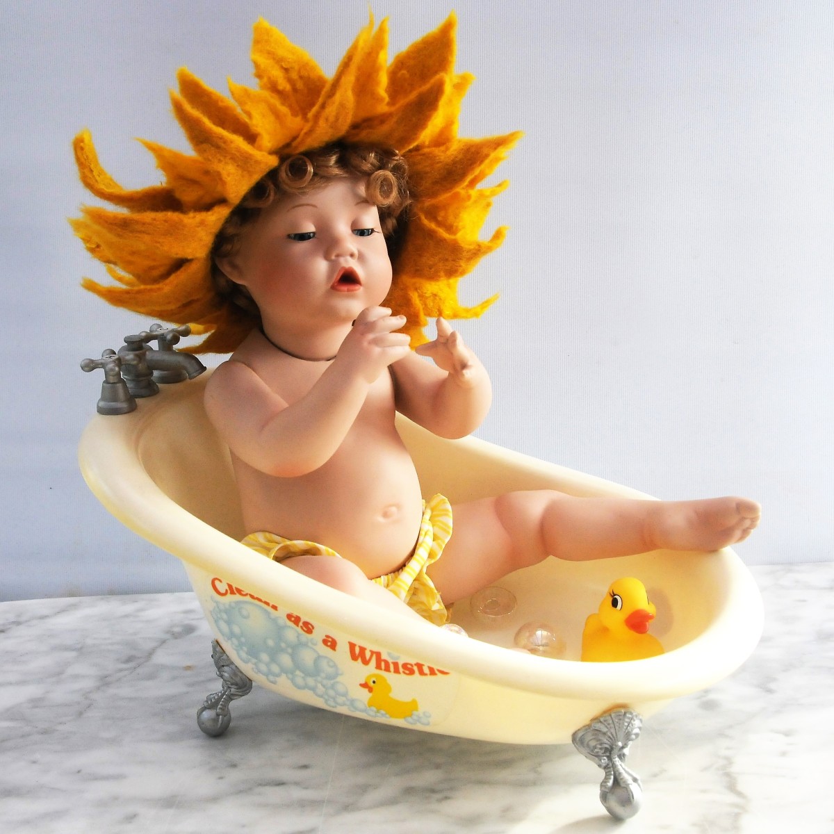 Little Miss Sunshine, bathing in a wet felted sunshine hat.