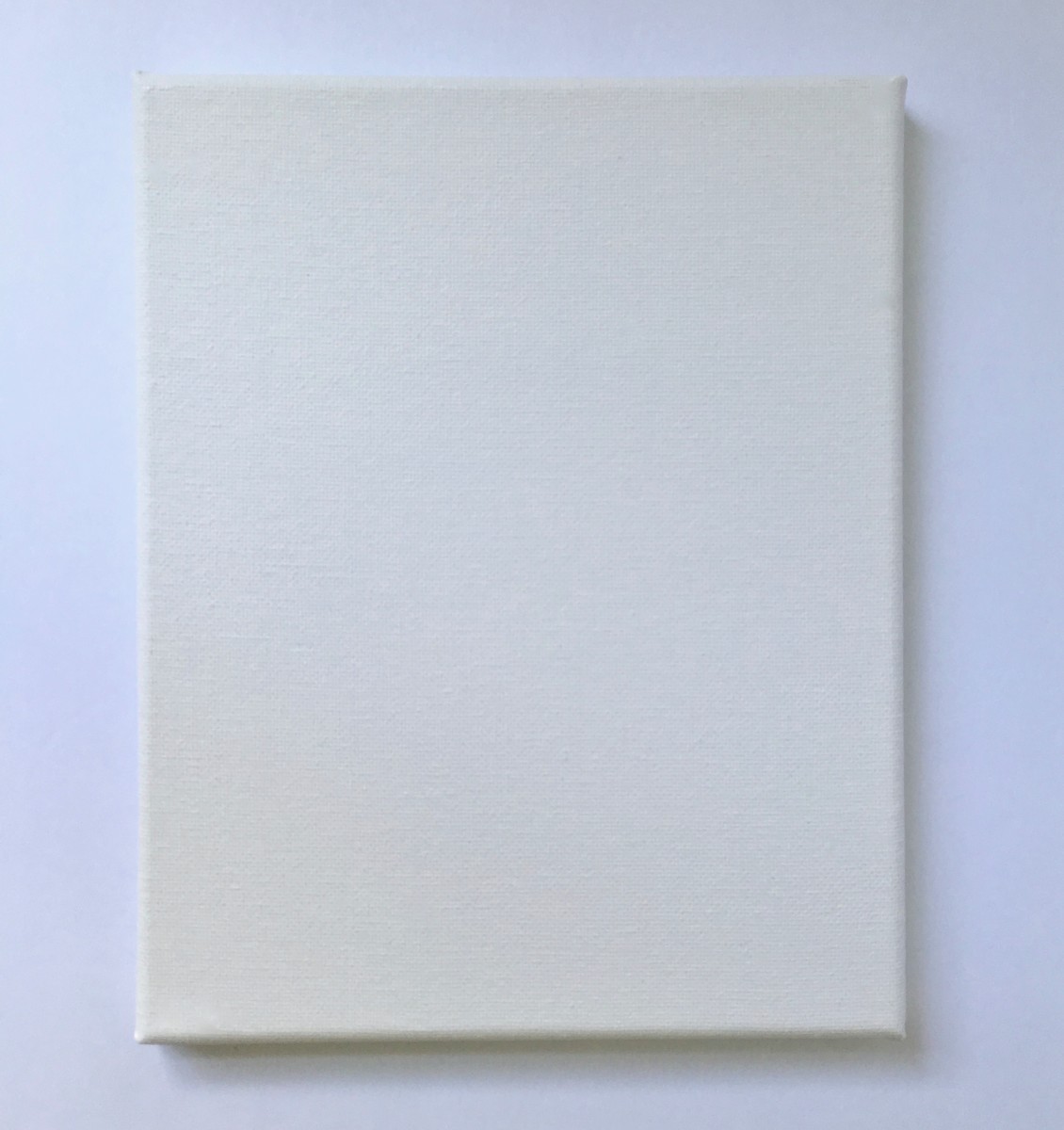 A stretched canvas for pour painting.