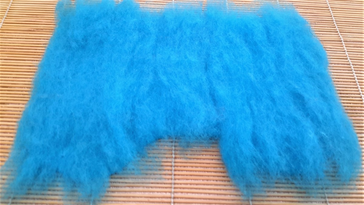 The 2nd side of layer 1 covered with Merino fibers.