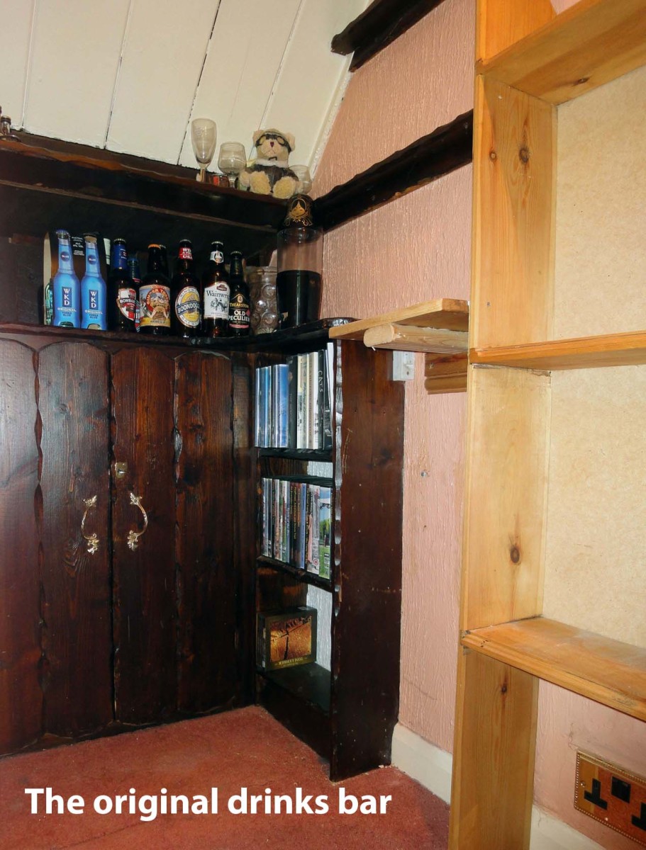 Original drinks bar tucked away in the corner of the alcove under the stairs (at the back of the living room), as it was a few years back; prior to me building the current DVD shelving to the right.