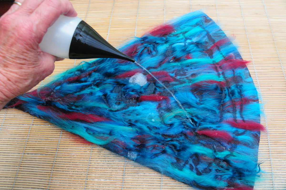 Cover the last layer with a fine layer of wool roving.