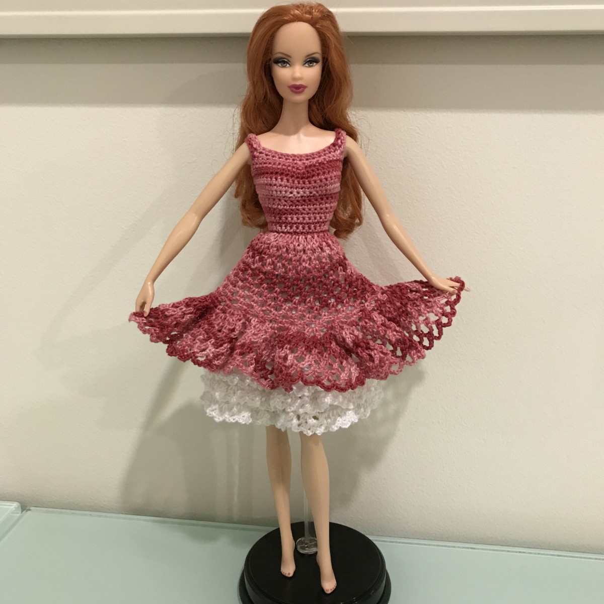 Barbie holding the skirt wide with her hands